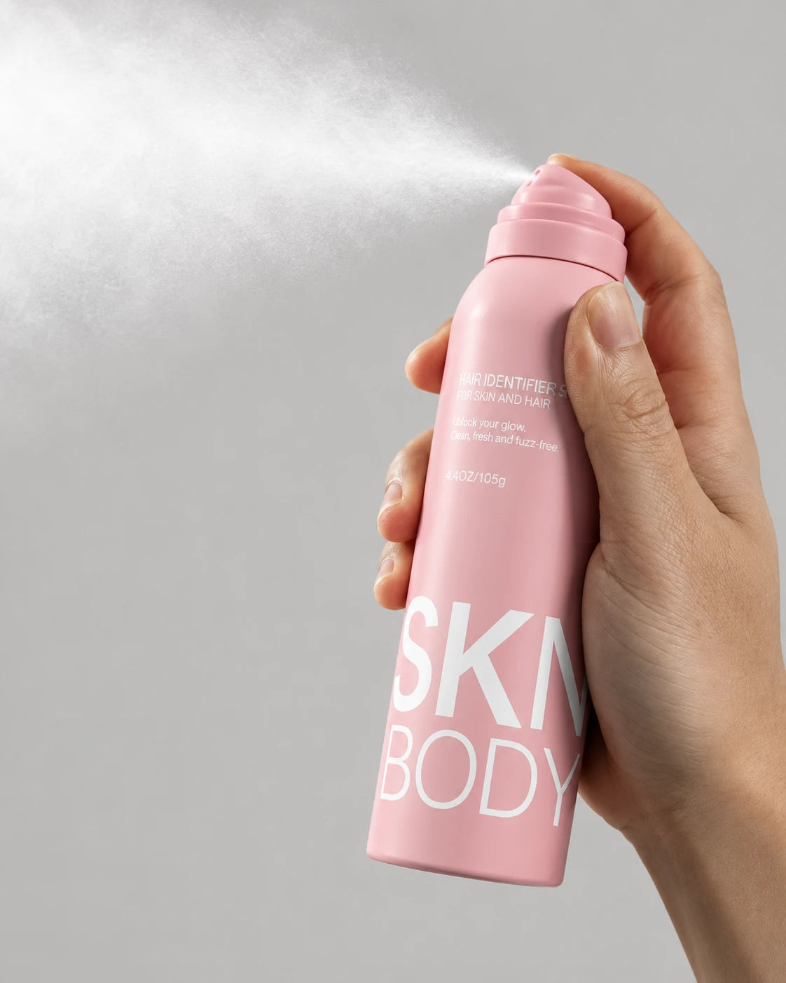 Hair Identifier Spray releasing a fine mist